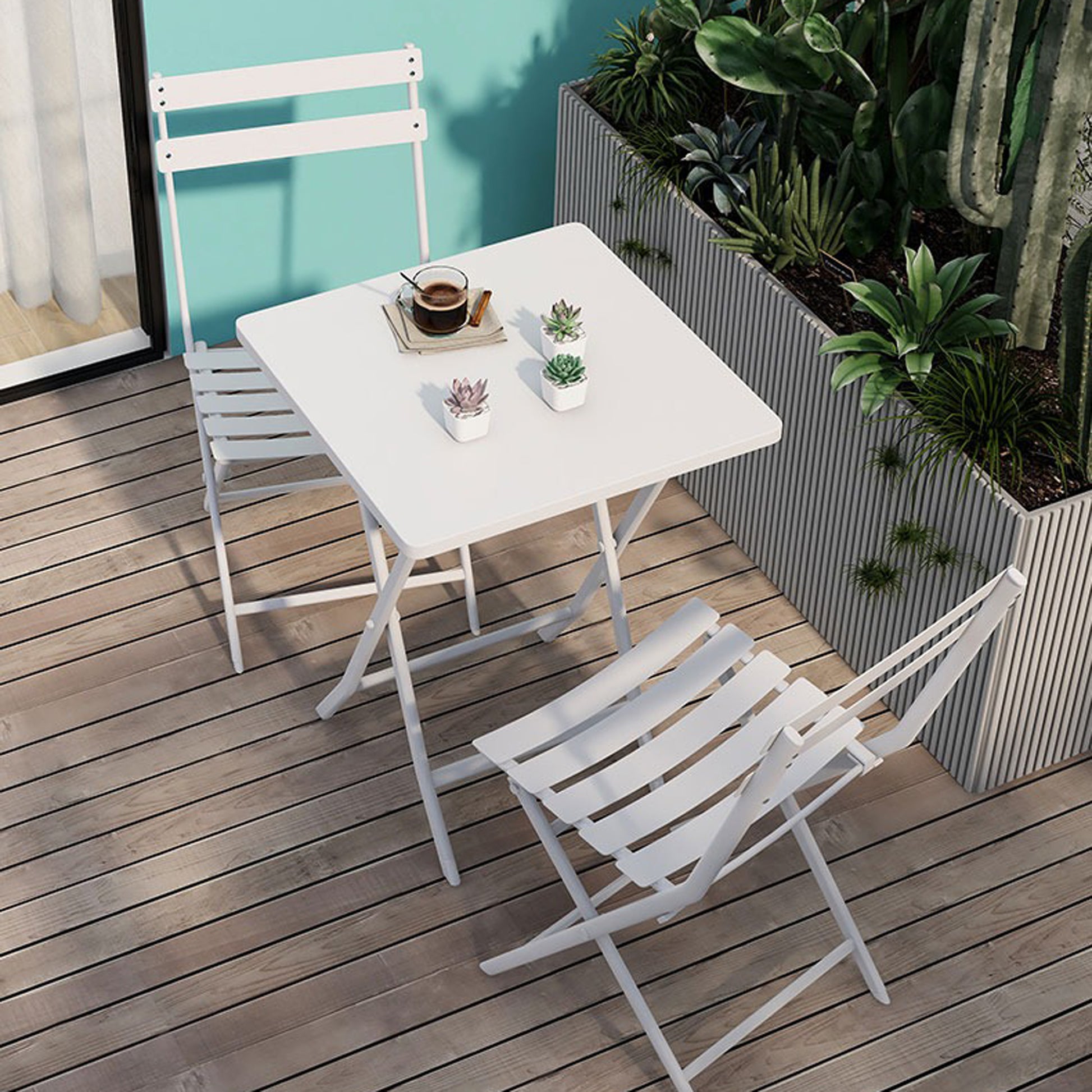 White metal folding bistro set with square table and slatted chairs on wooden deck