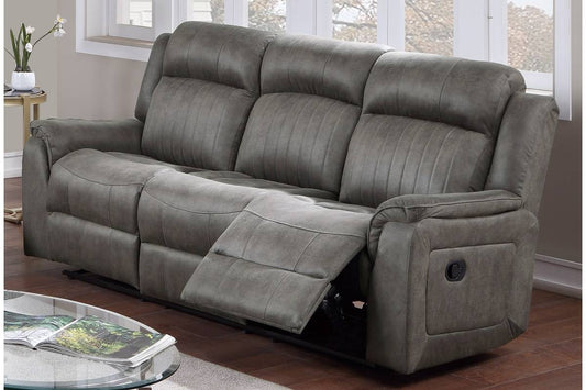 Gray reclining sofa with channeltufted back cushions and plush armrests