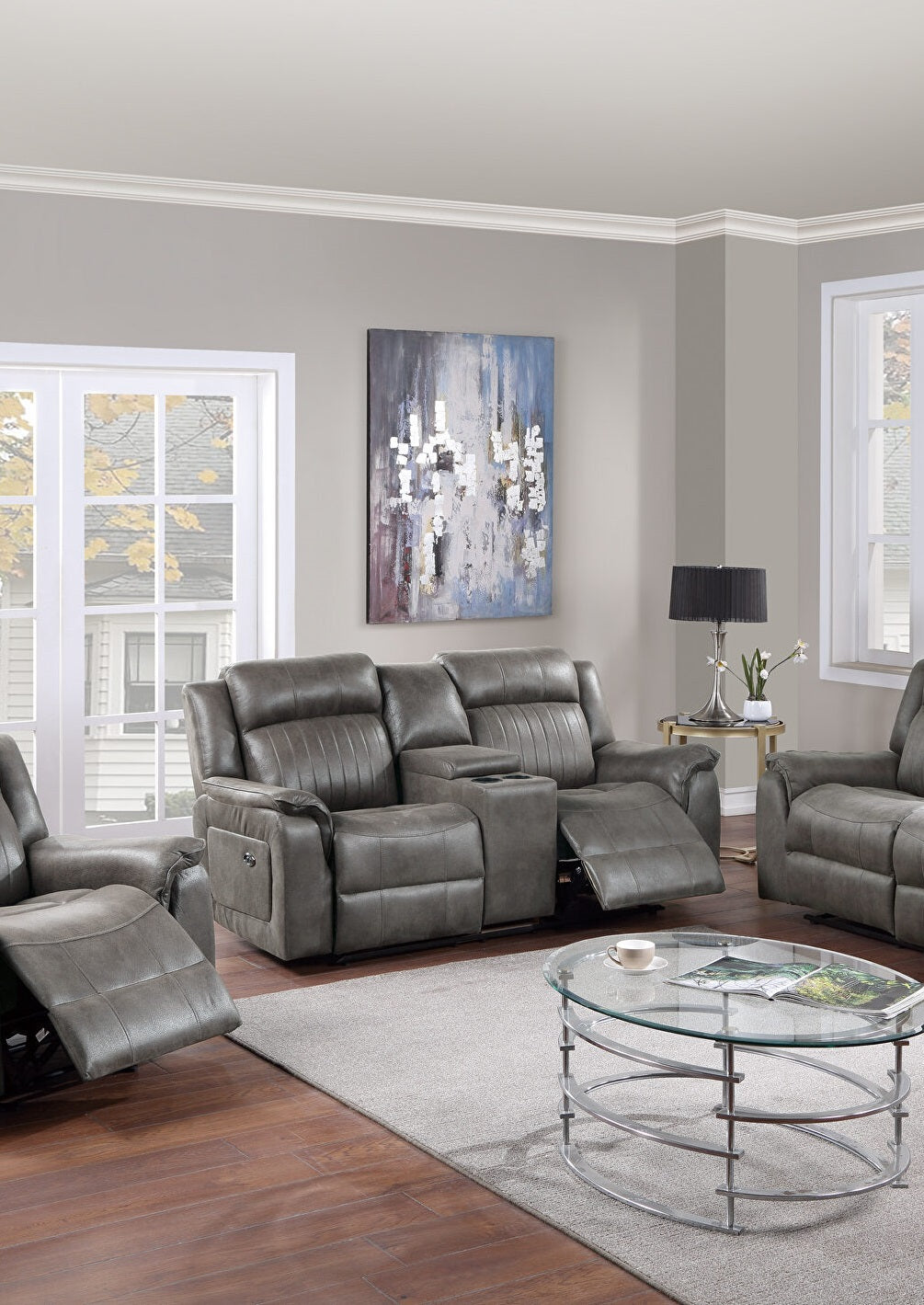 Comfortable gray leather recliner loveseat with builtin cup holders for a cozy living room