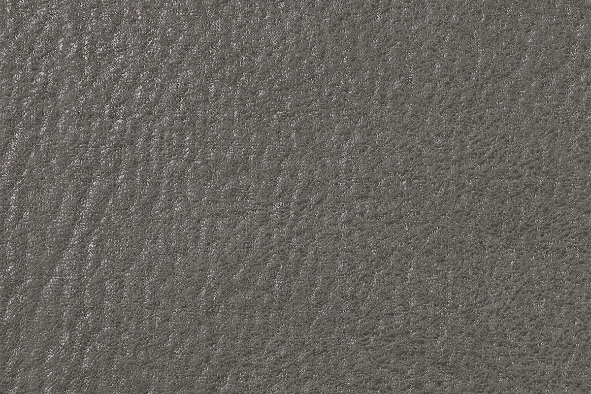 Closeup texture of a grey pebble grain leather material