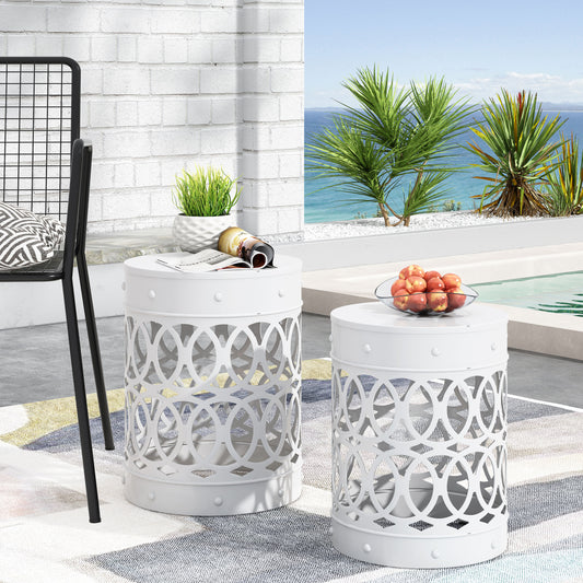 White metal garden stool with decorative cutout design