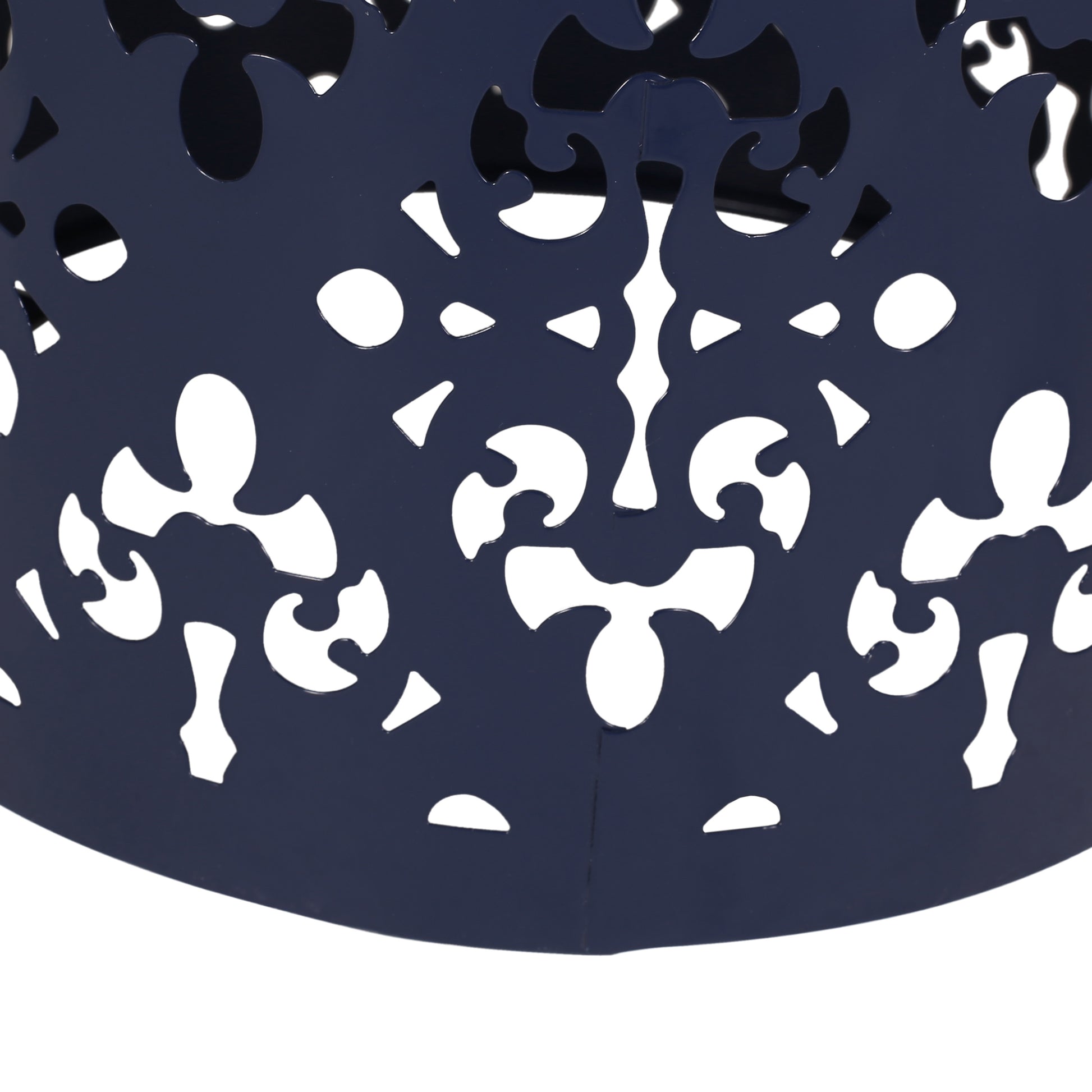Dark blue metal lantern with intricate scrollwork cutouts white background