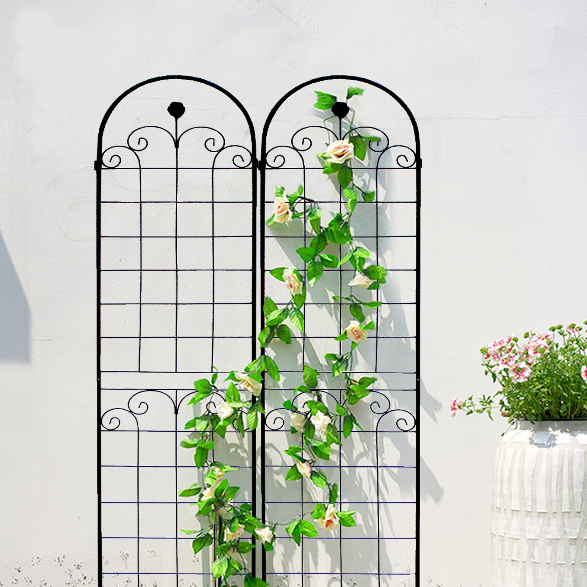 Black metal garden trellis with faux rose vine for climbing plants support