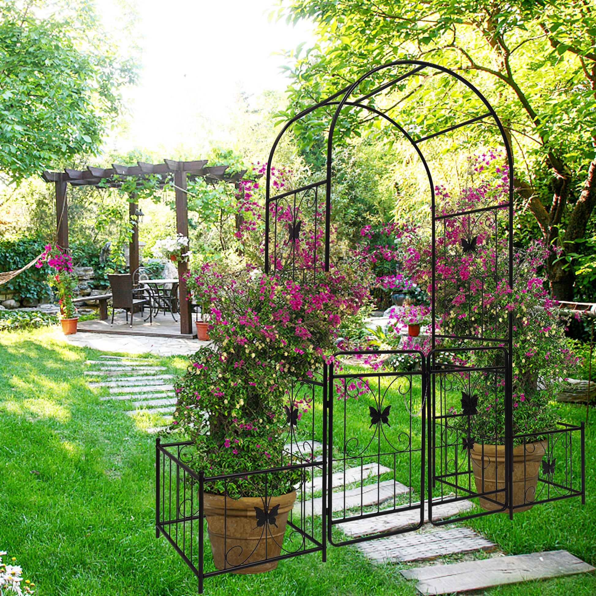 Black metal garden archway with butterfly accents and attached gates perfect for wedding decor