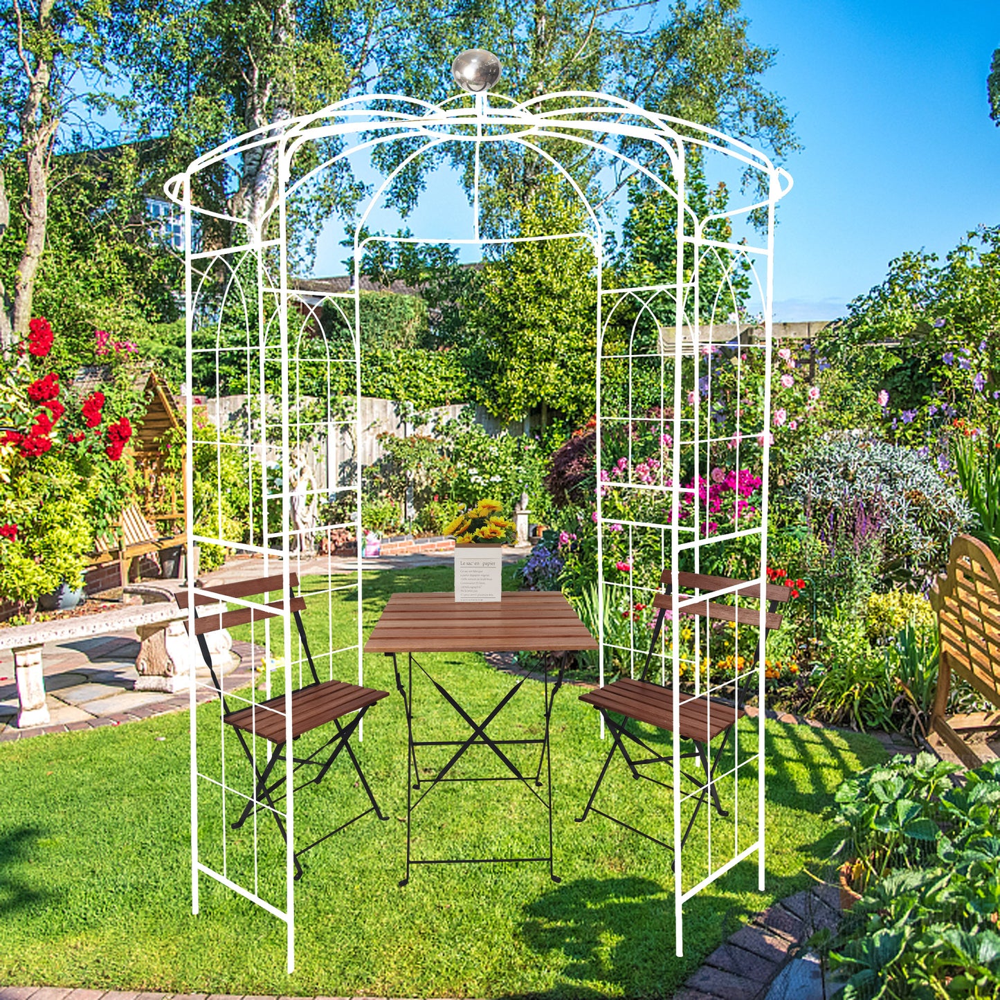 White metal garden arbor with a bistro set perfect for a charming outdoor seating area
