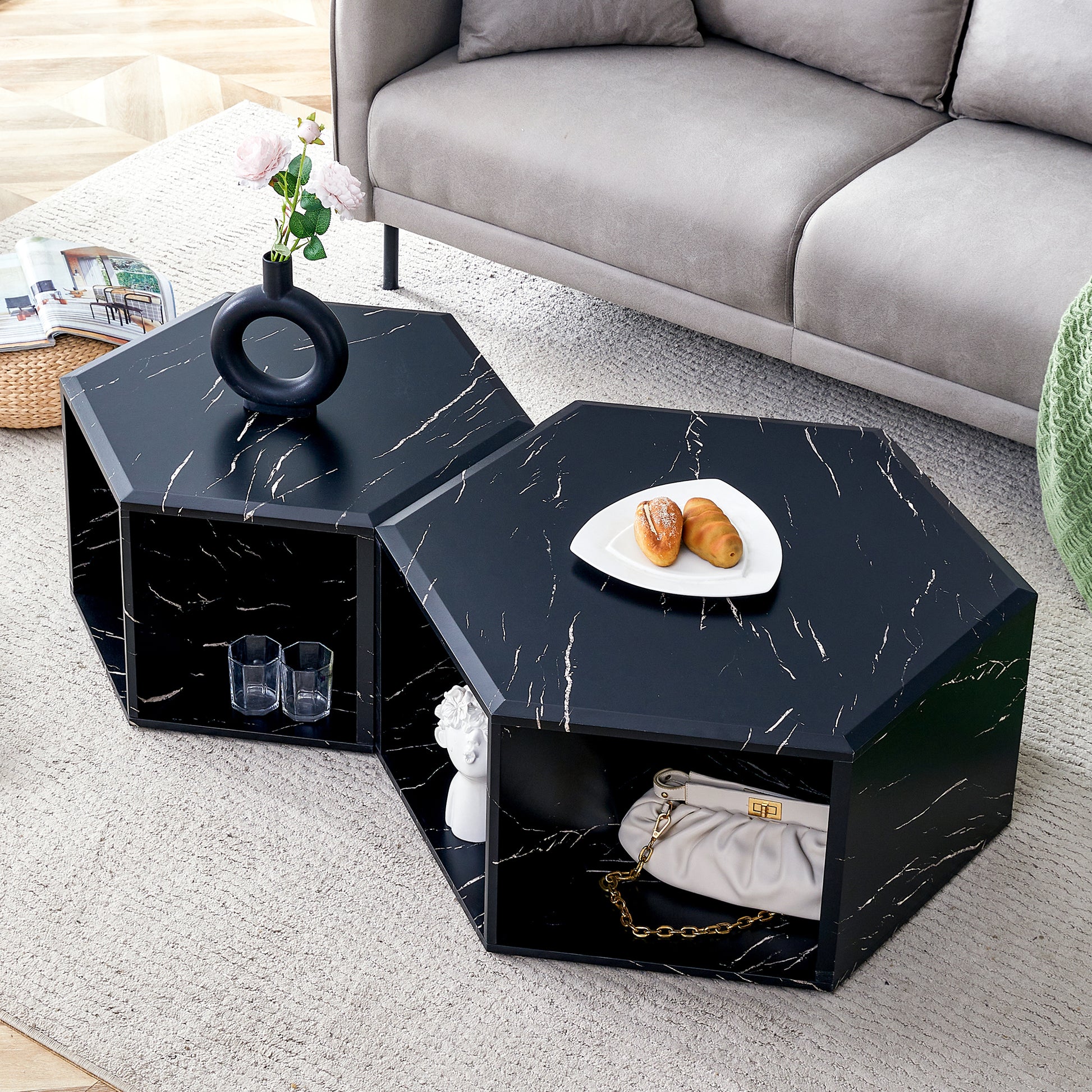 Geometric black marble coffee table with storage shelves and gold hardware