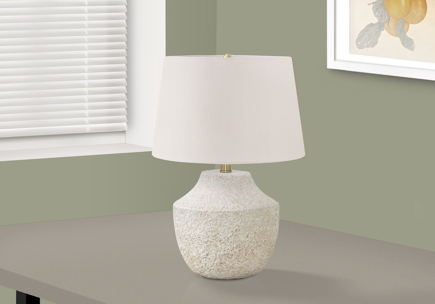 Cream fabric lampshade on a textured offwhite base a modern table lamp