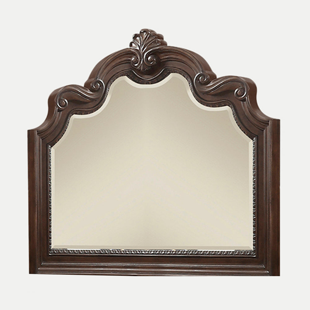 Ornate dark wood dresser mirror with scalloped top edge and carved detail