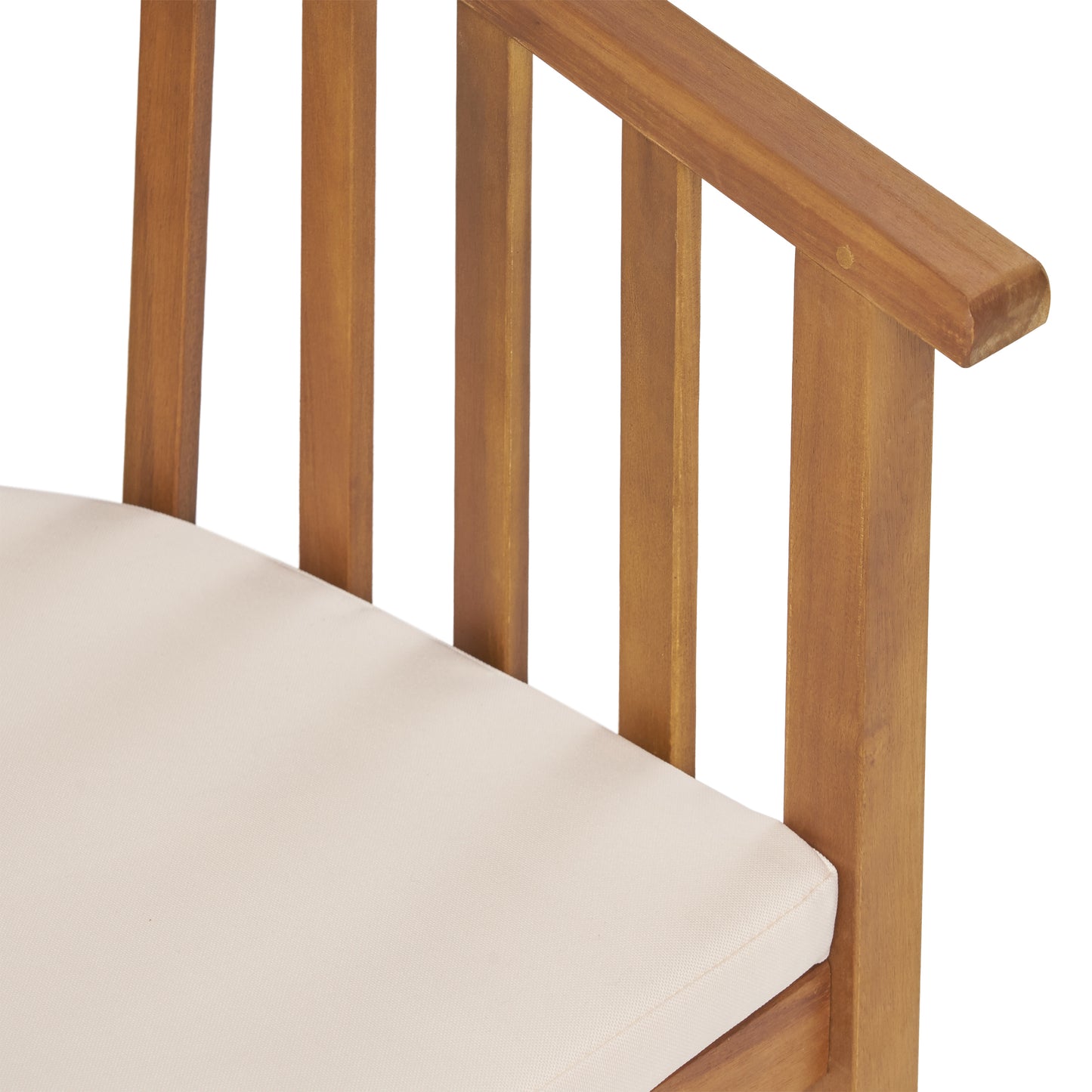 Closeup of natural wood outdoor chair armrest with ivory cushion