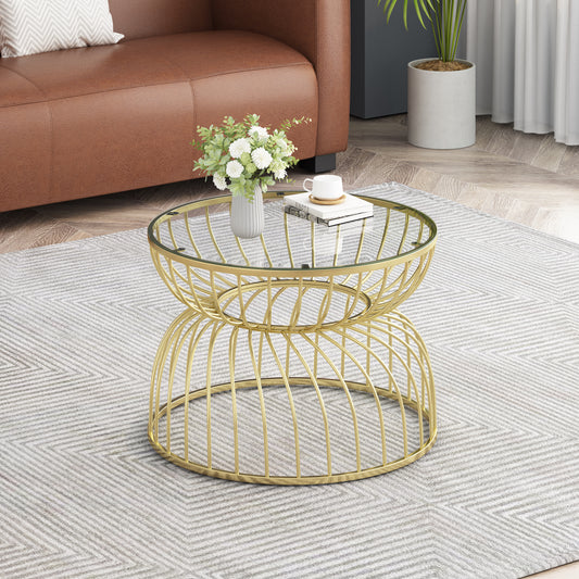 Gold metal coffee table with glass top featuring an intricate wire base design