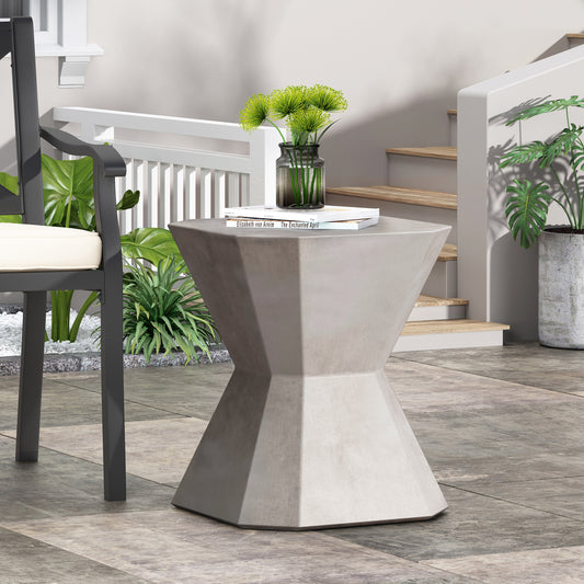 Modern geometric concrete side table with textured finish ideal for patio use