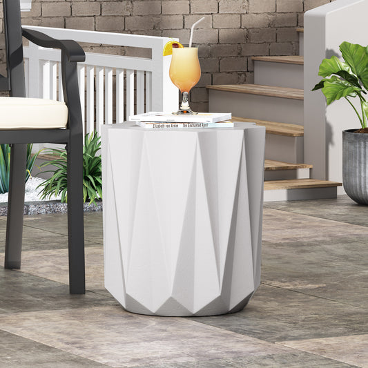 White faceted geometric concrete garden stool with textured surface