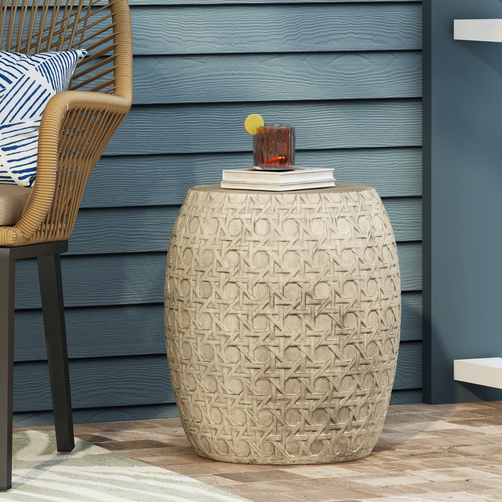 Beige rattan garden stool with intricate woven pattern perfect for outdoor seating