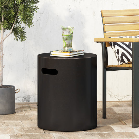 Black cylindrical outdoor accent table with cutout handle for easy portability