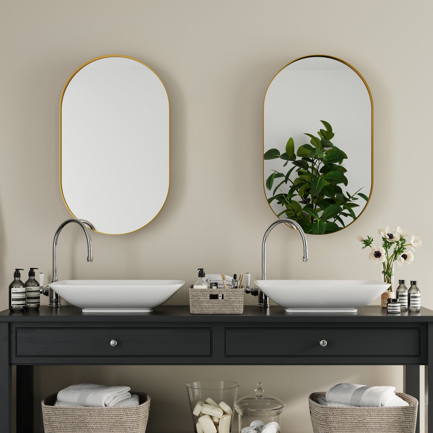 Modern oval bathroom mirror with gold frame complementing contemporary vanity design
