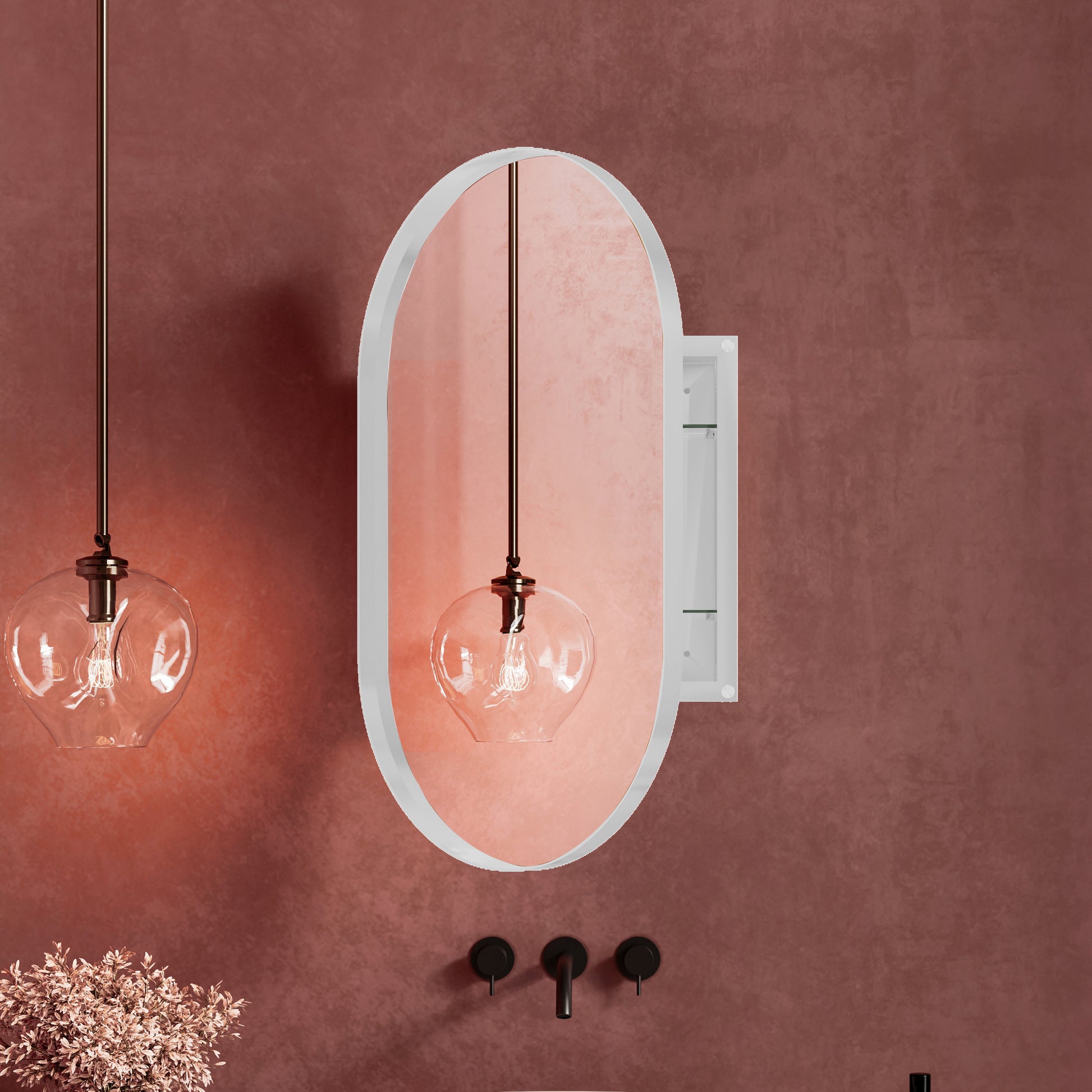 Oval bathroom mirror with recessed medicine cabinet and brass pendant light