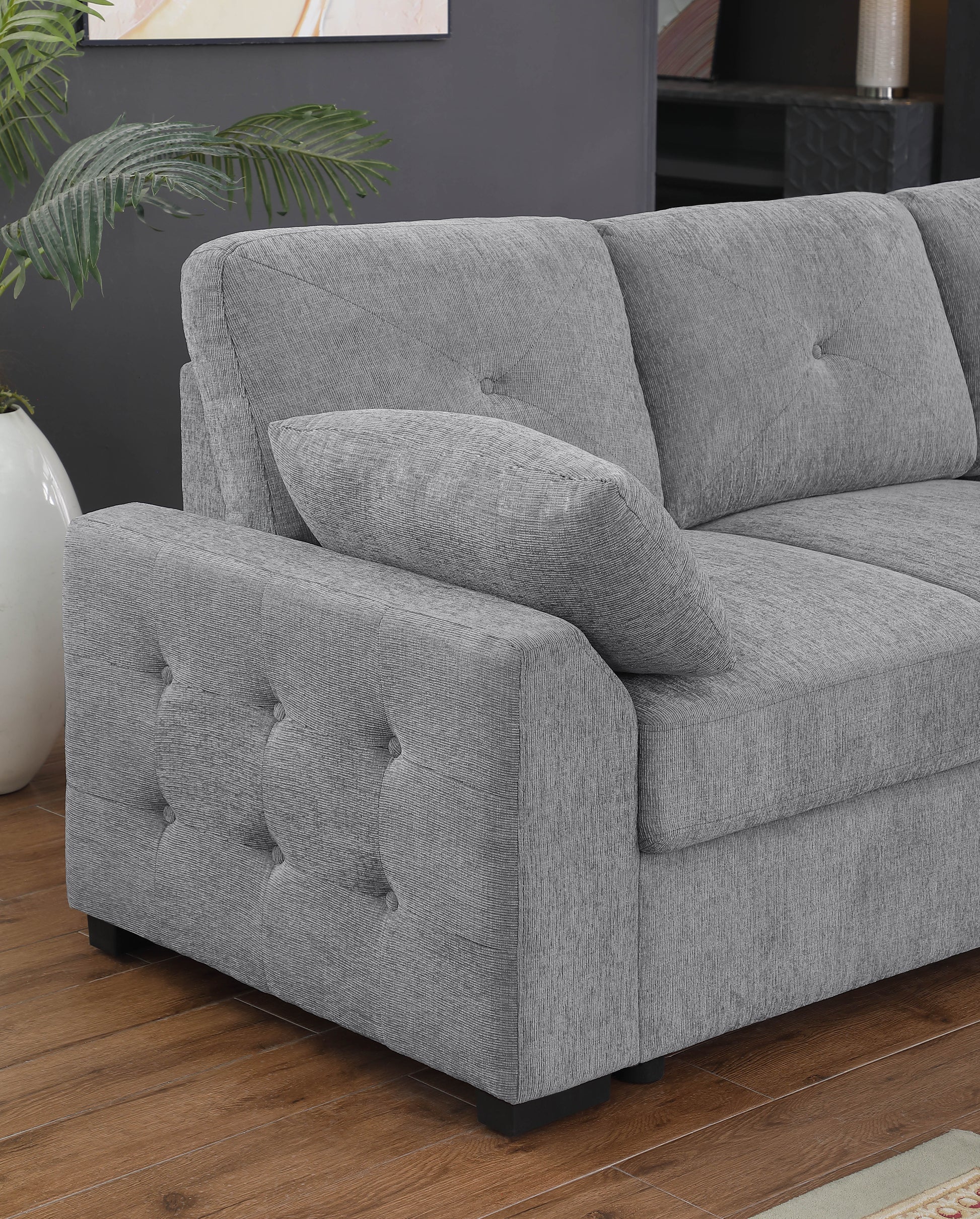 Contemporary grey fabric sectional sofa with tufted armrest and seat cushions for modern living room