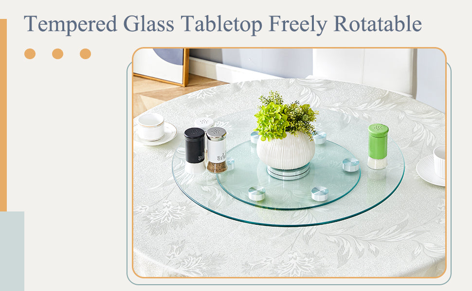 Glass turntable with white vase and green plant ideal for dining tables