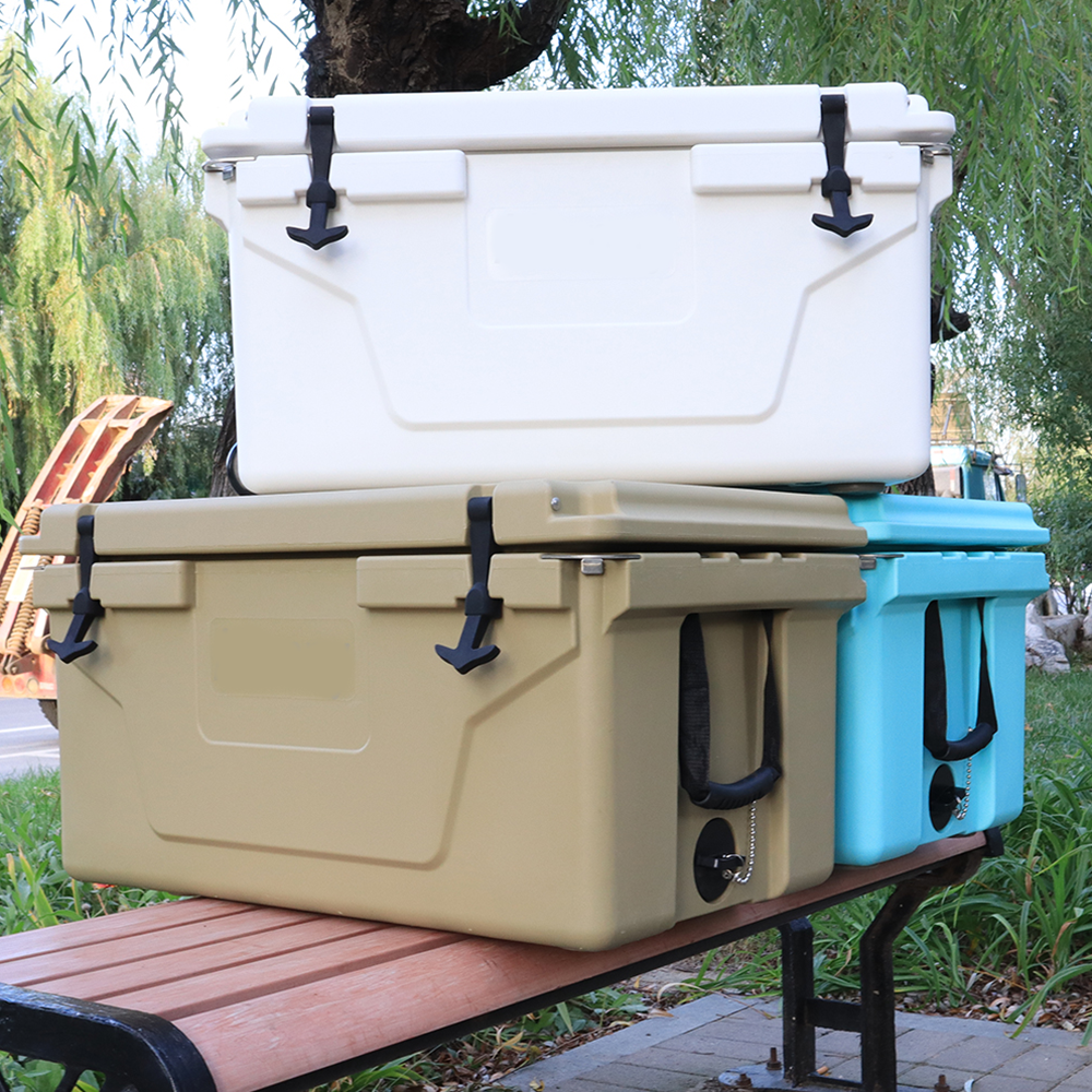 Stack of three hardshell coolers white tan and blue ideal for camping