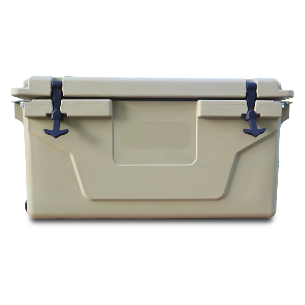 Tan hardsided cooler with black latches and a white background