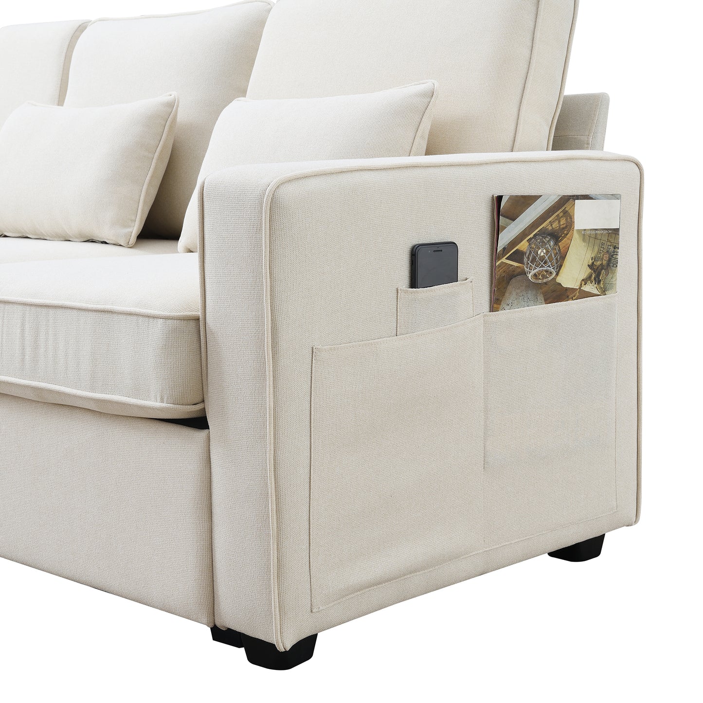 Cream fabric sofa with convenient side pocket for magazines and phone storage
