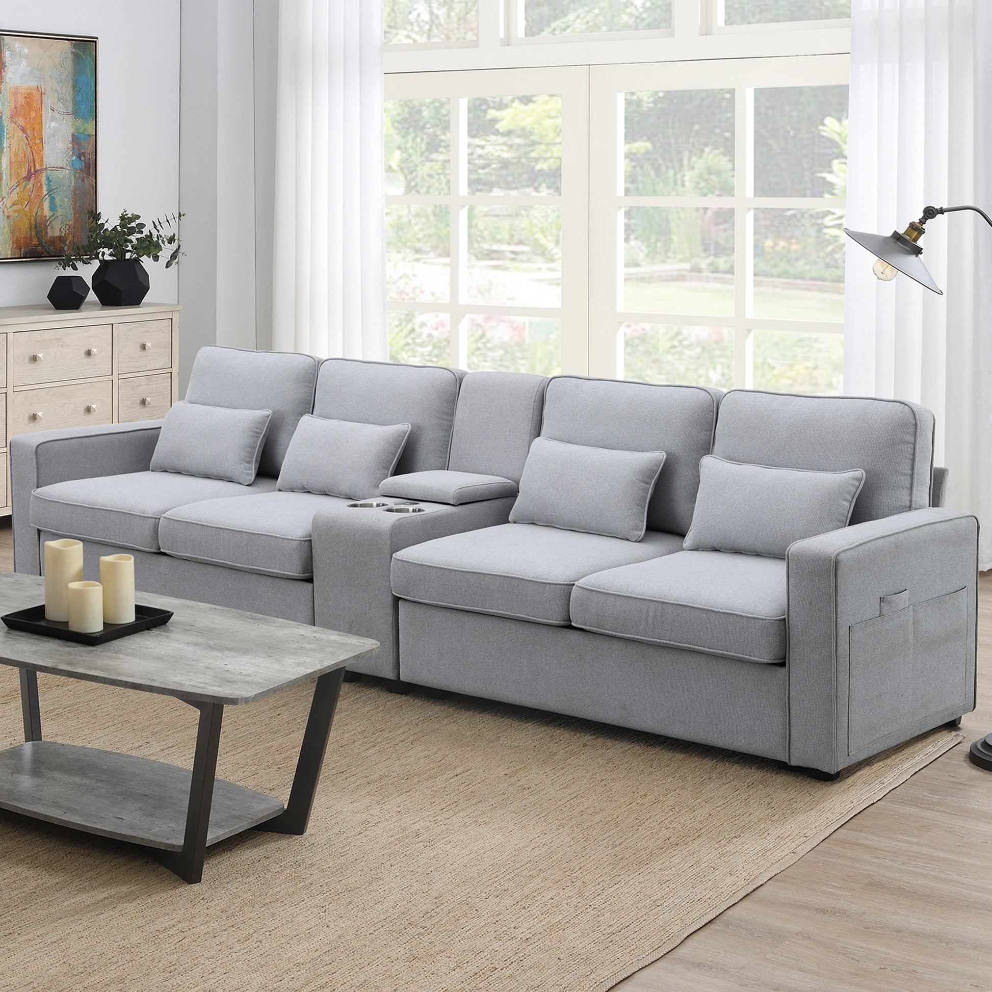 Gray fabric sectional sofa with builtin cup holders and lumbar pillows