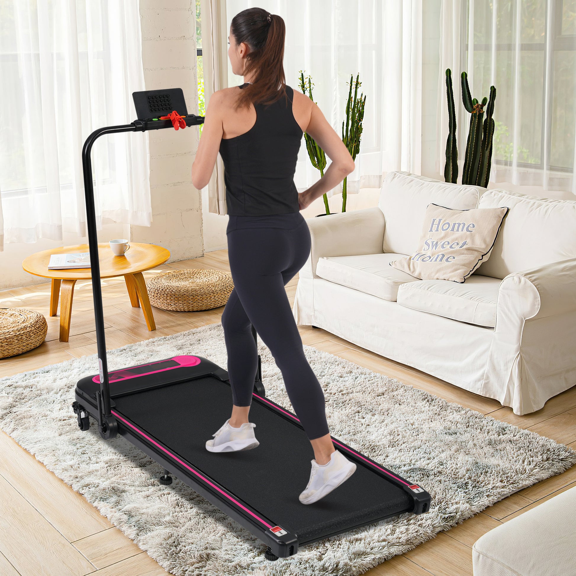 Compact black folding treadmill with pink accents ideal for home workouts