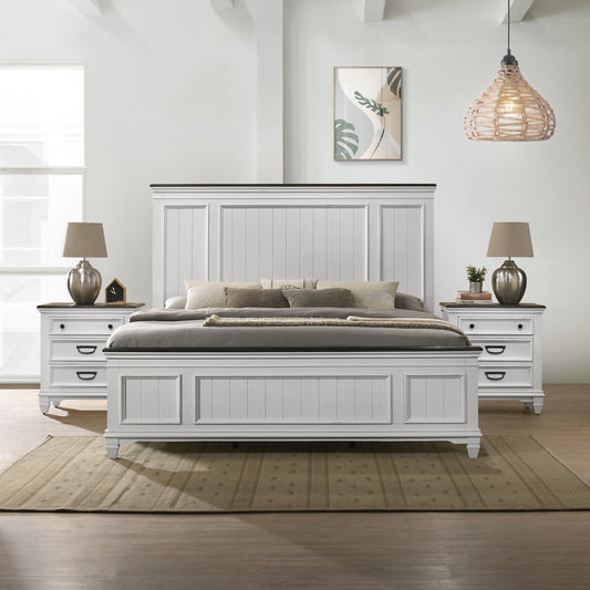 White paneled king bed with dark wood accents and upholstered footboard