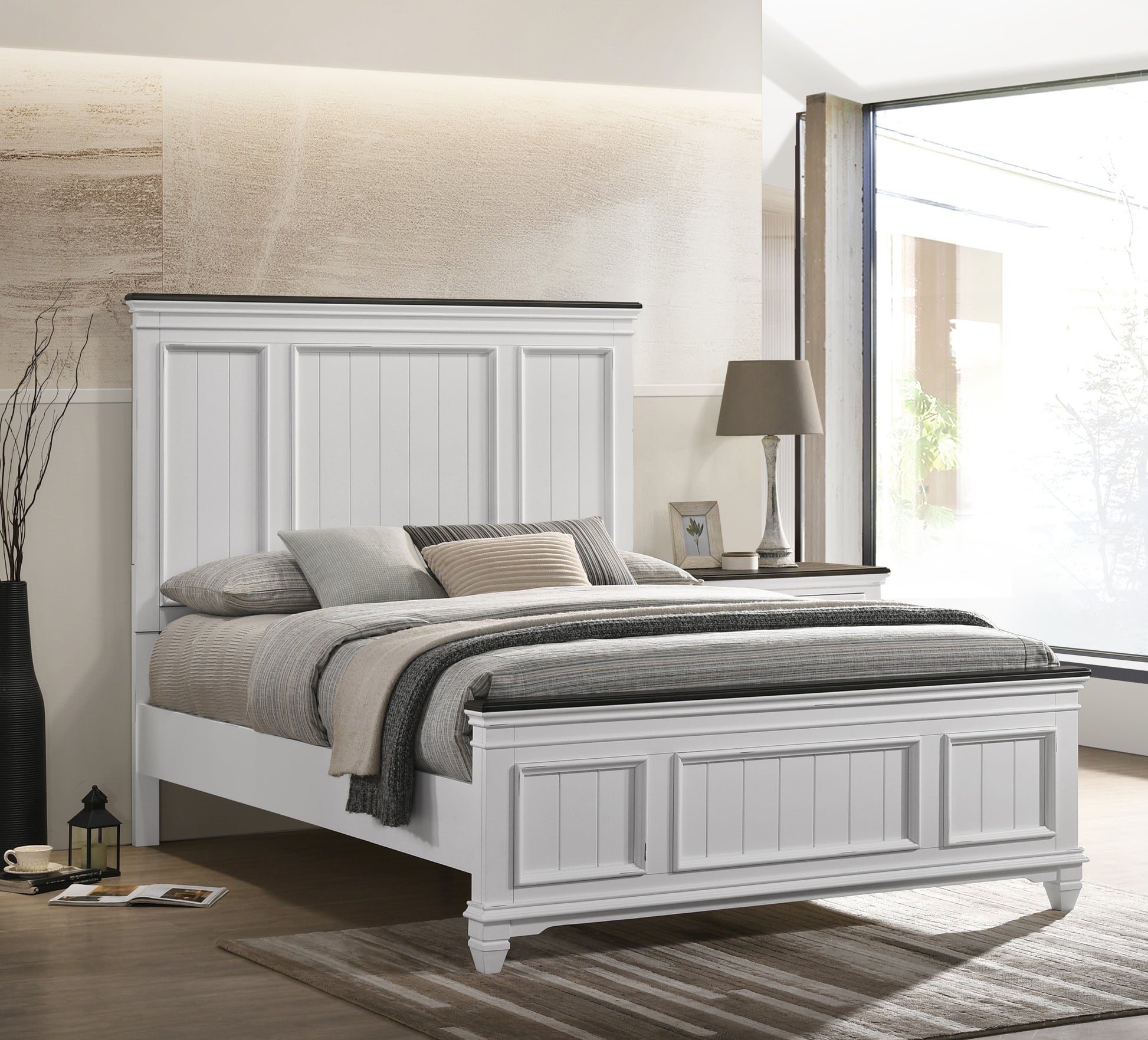 White panel headboard king size bed with textured pillows
