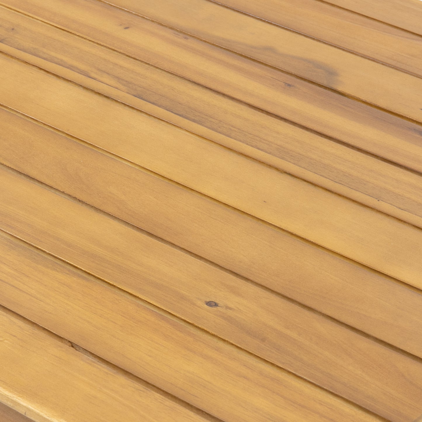 Closeup of natural wood grain on a honeycolored slat table surface