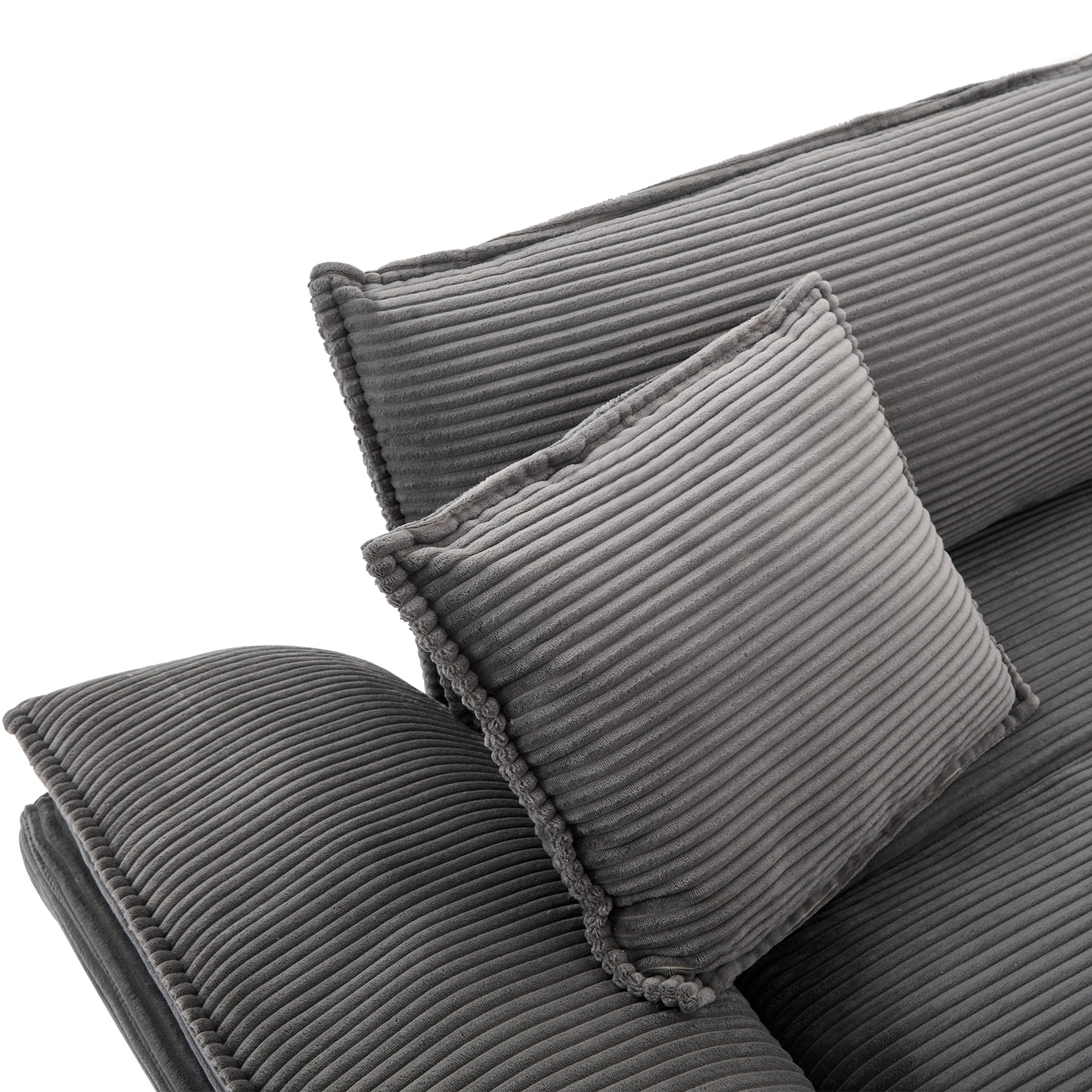 Closeup of a plush grey corduroy pillow with a textured finish perfect for a cozy living room