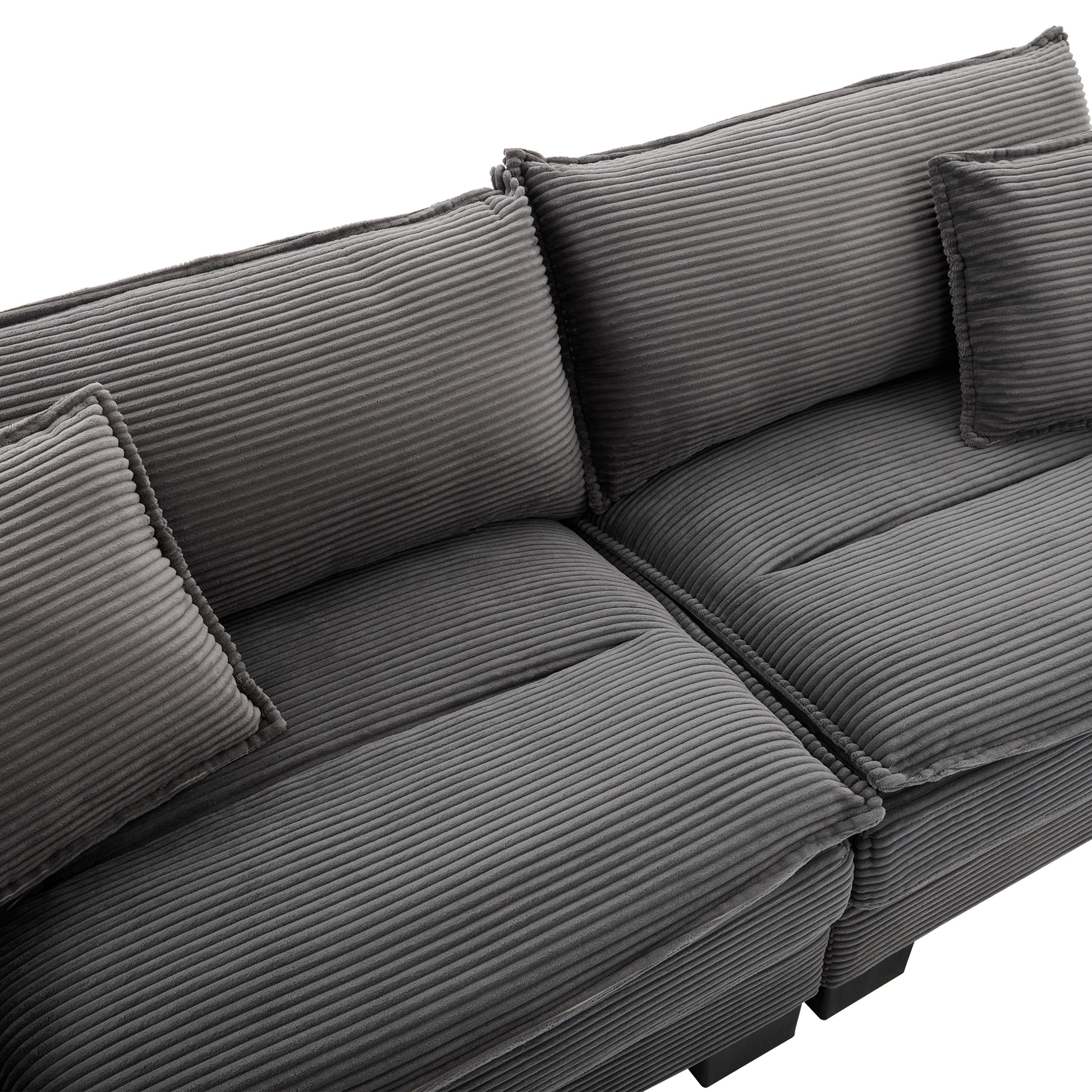 Deep grey corduroy sofa with plush cushions and modern design