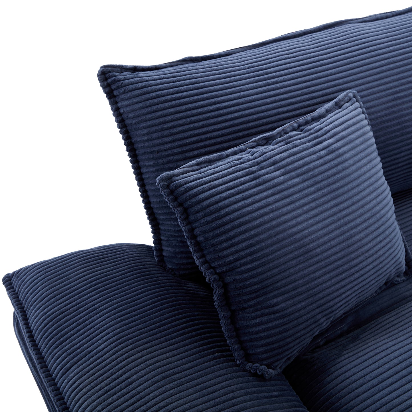 Closeup of textured navy corduroy couch cushions with plush feel
