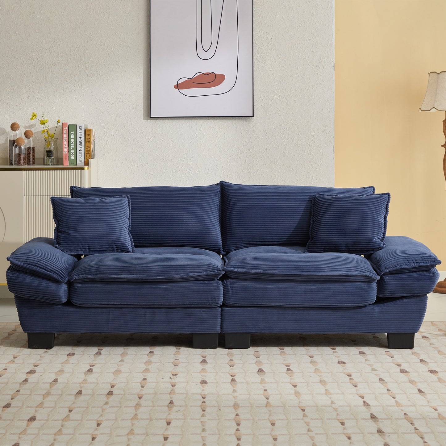 Deep navy corduroy sofa with plush cushions perfect for a modern living room