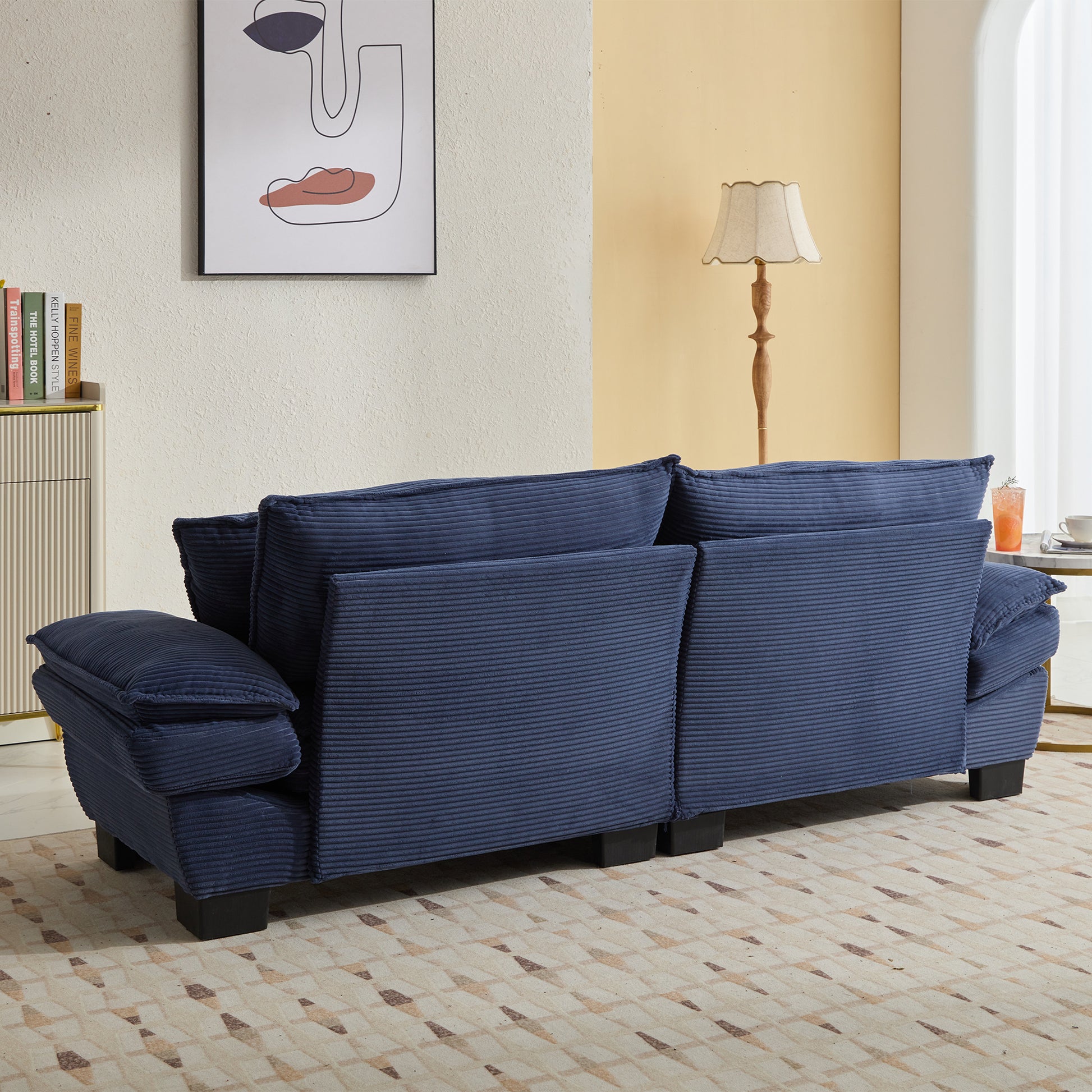 Navy blue corduroy sofa with deep seating and plush cushions perfect for modern living rooms