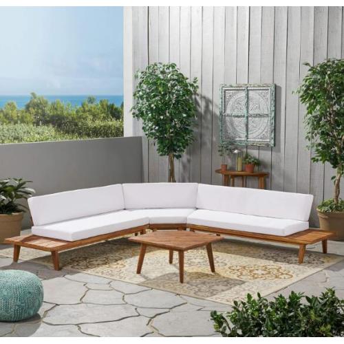 Teak wood sectional sofa with white cushions and a matching square coffee table