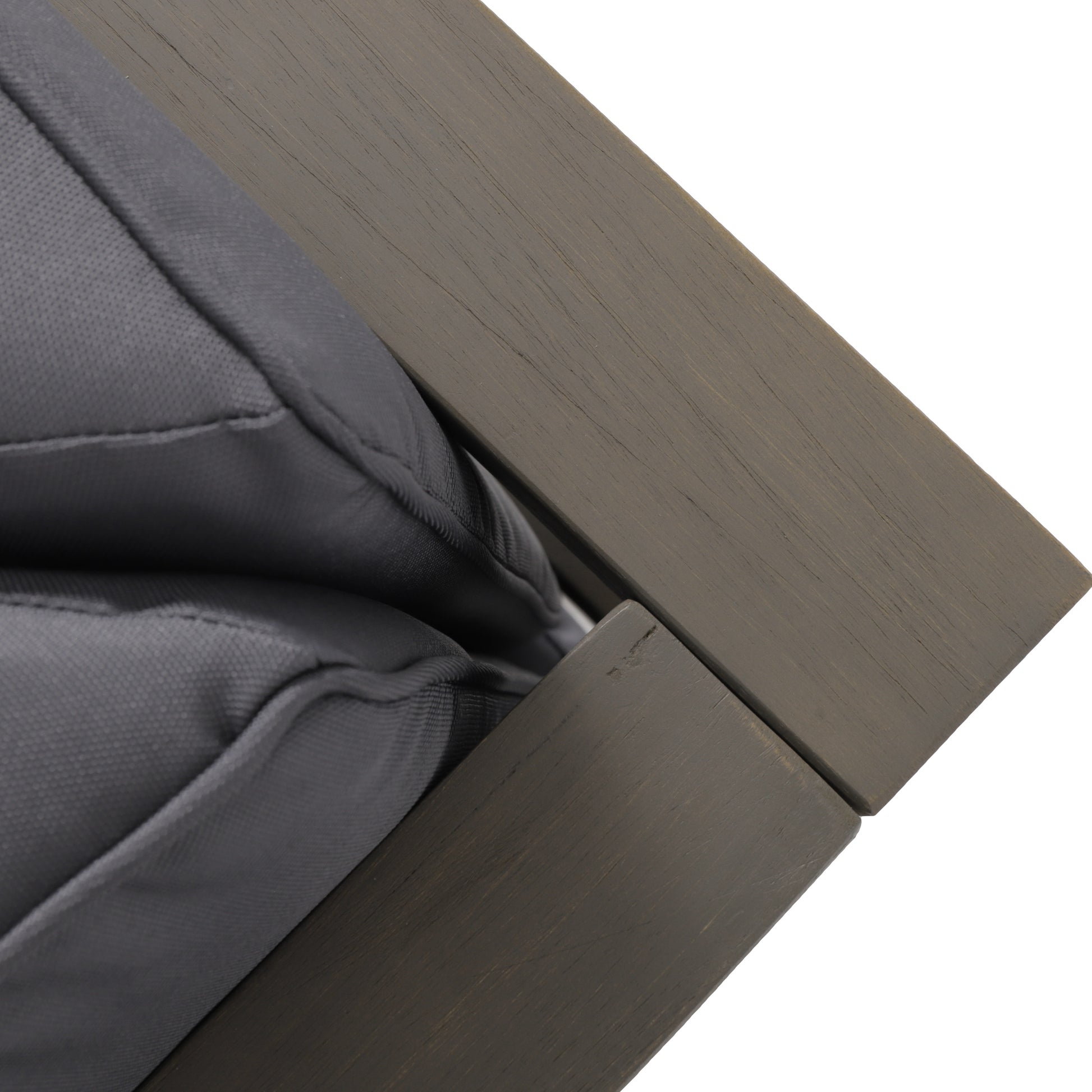 Dark gray outdoor chair cushion with textured fabric and a distressed wood frame accent