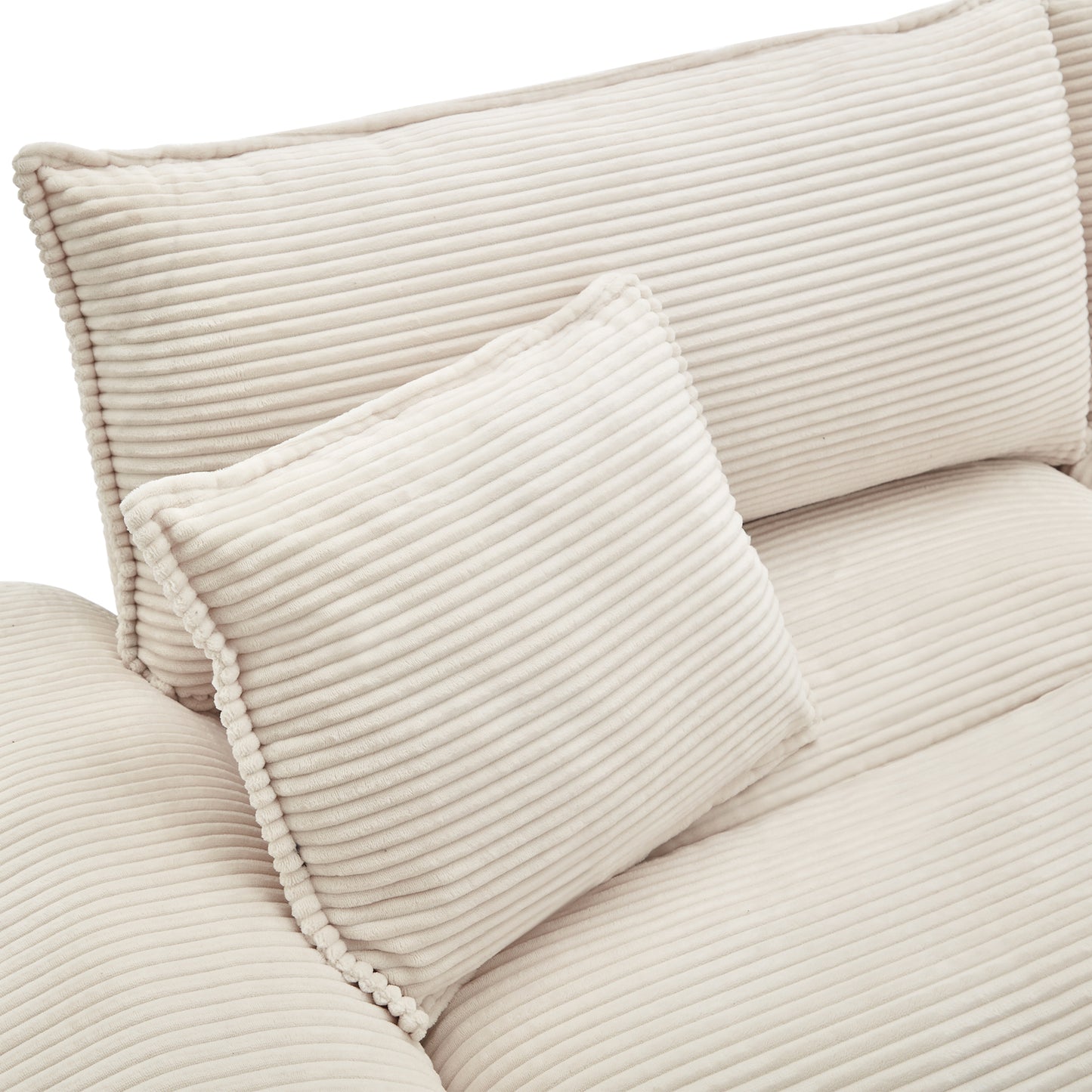 Closeup of plush cream corduroy sofa pillows with textured ribbed fabric