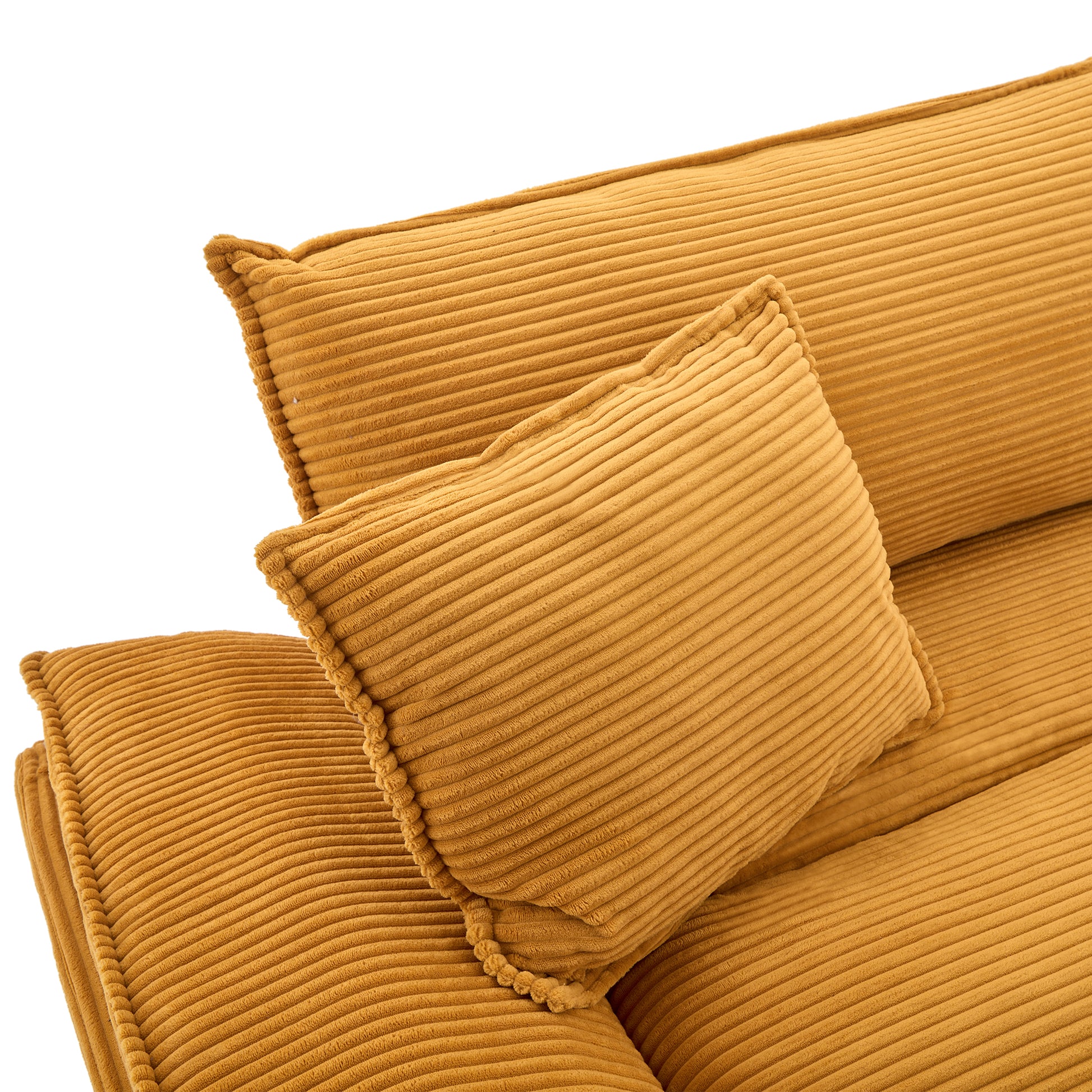 Textured gold corduroy sofa cushions with braided trim