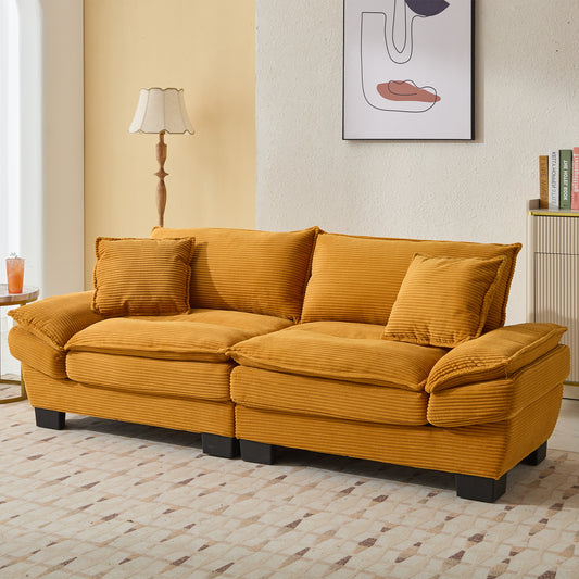 Plush mustard corduroy sofa with deep seating and accent pillows
