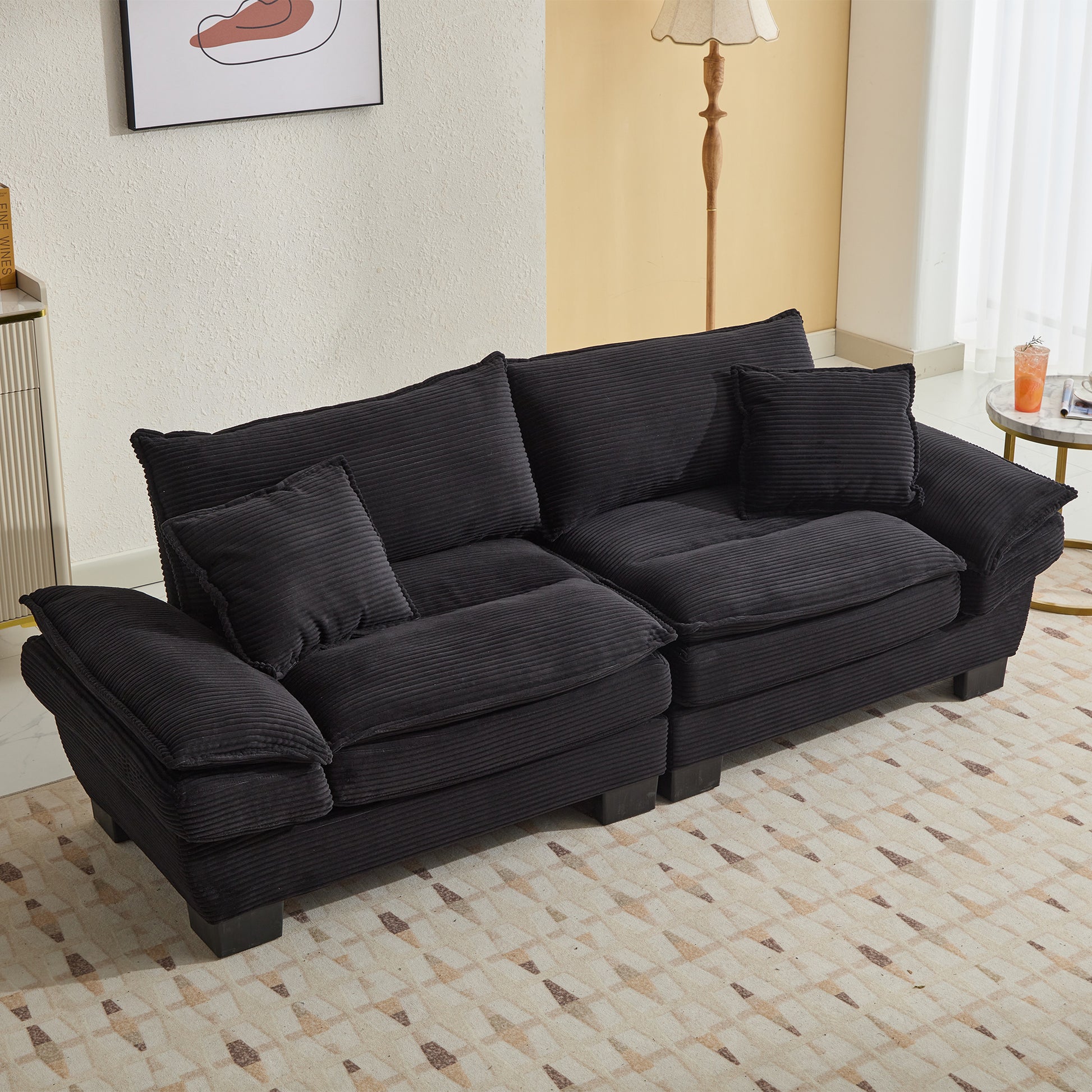Plush black corduroy sectional sofa with plush cushions for ultimate comfort
