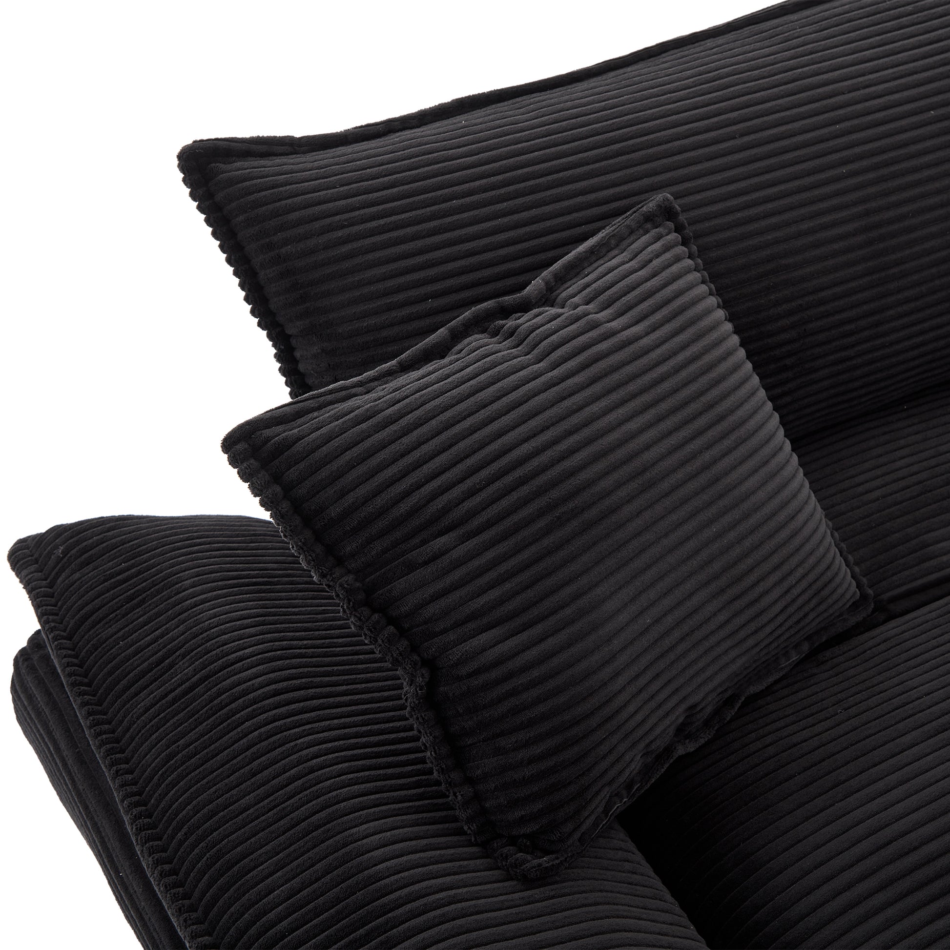 Black corduroy accent pillow with plush texture adds comfort to any couch