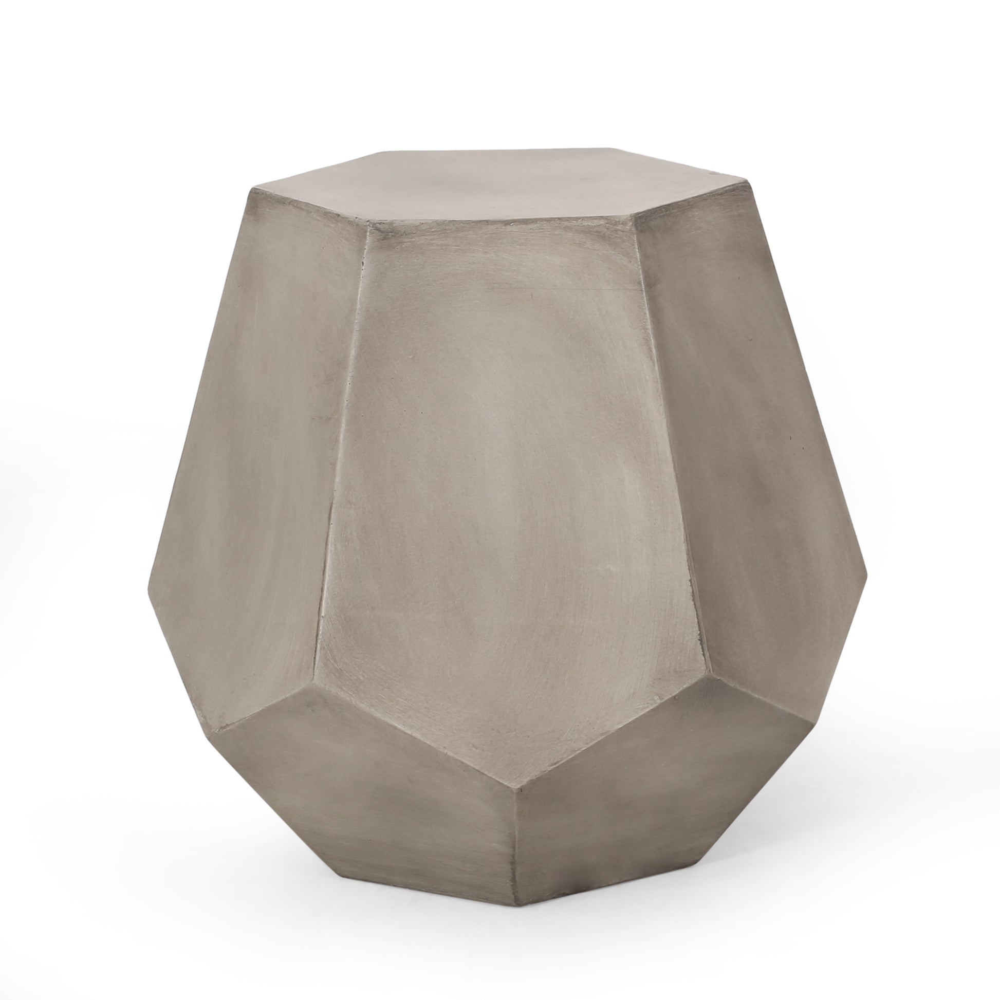 Geometric concrete garden stool with faceted sides in a neutral gray hue