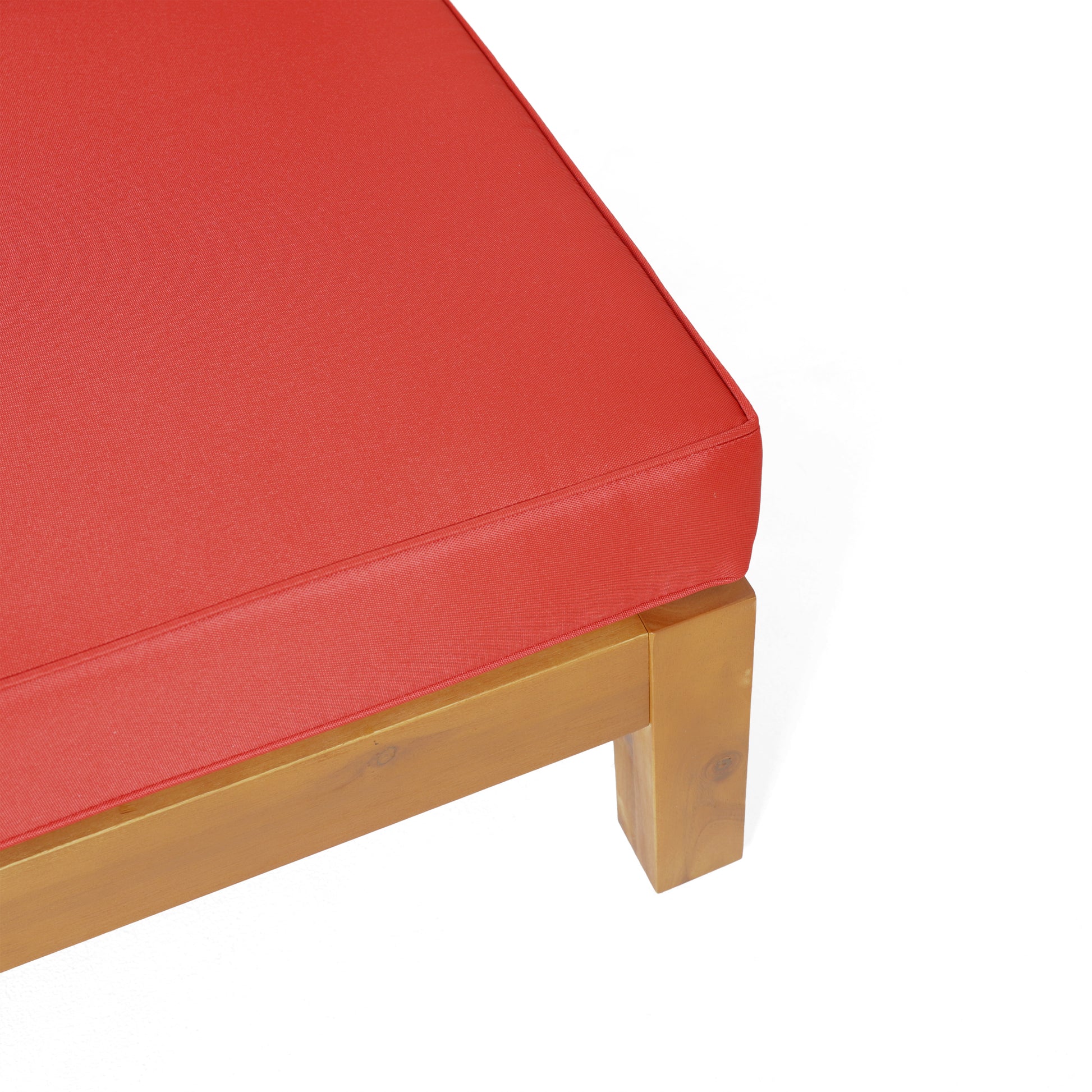 Close up of red outdoor chaise lounge cushion on wooden frame
