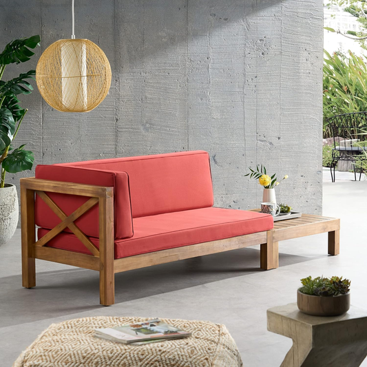 Outdoor sectional sofa with coral cushions and wooden frame perfect for patio lounging