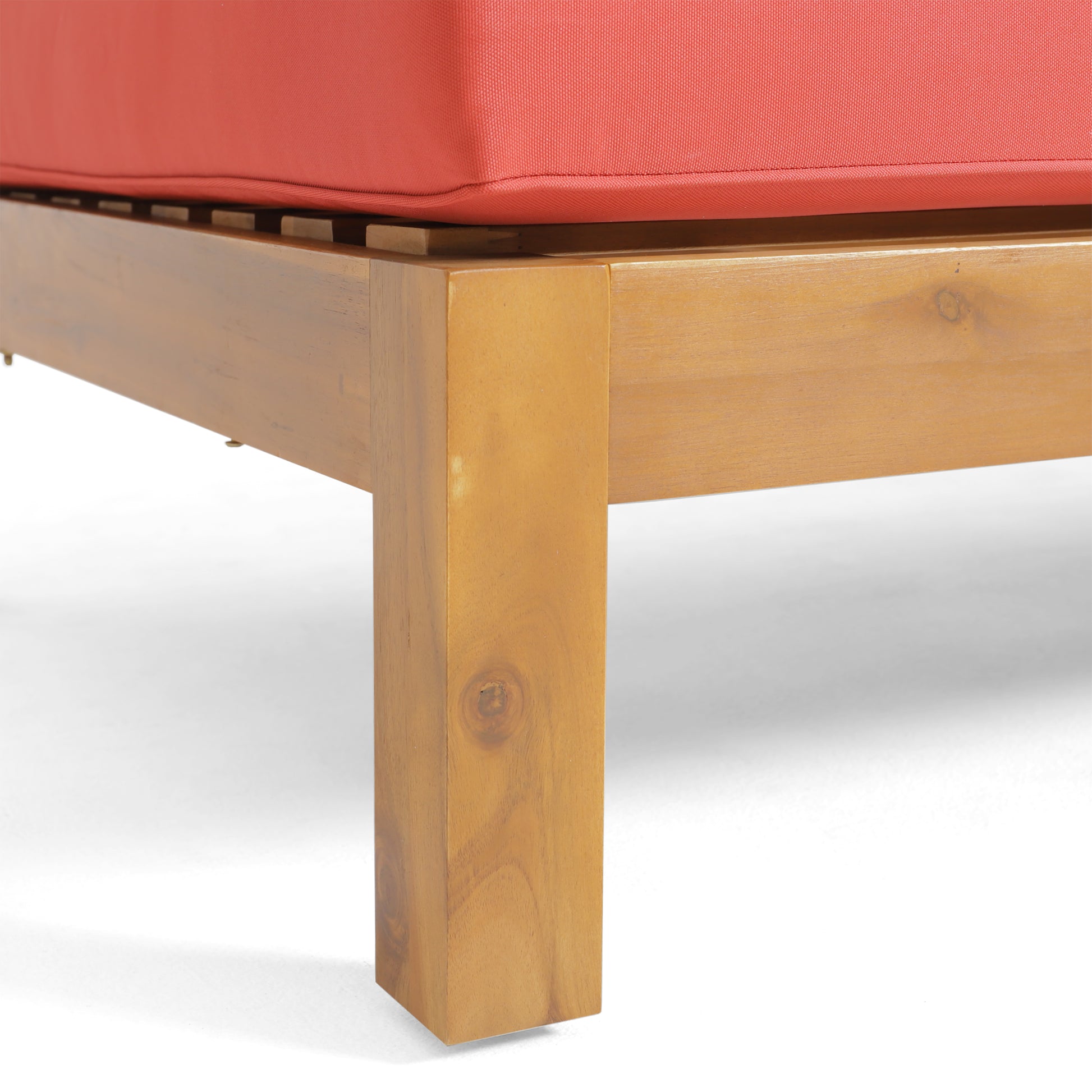 Closeup of a sturdy wooden leg for an outdoor lounge chair featuring a warm natural finish