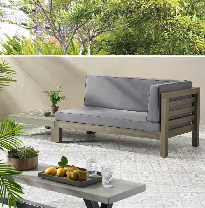 Modern gray outdoor sectional sofa with wood frame detail perfect for patio relaxation