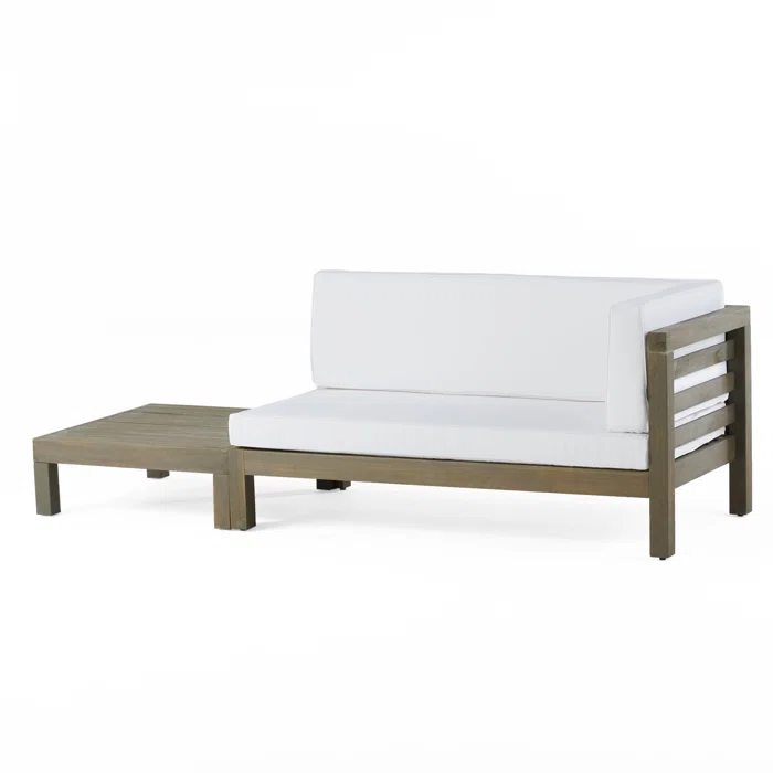 Modern sectional patio sofa with white cushions and weathered wood frame