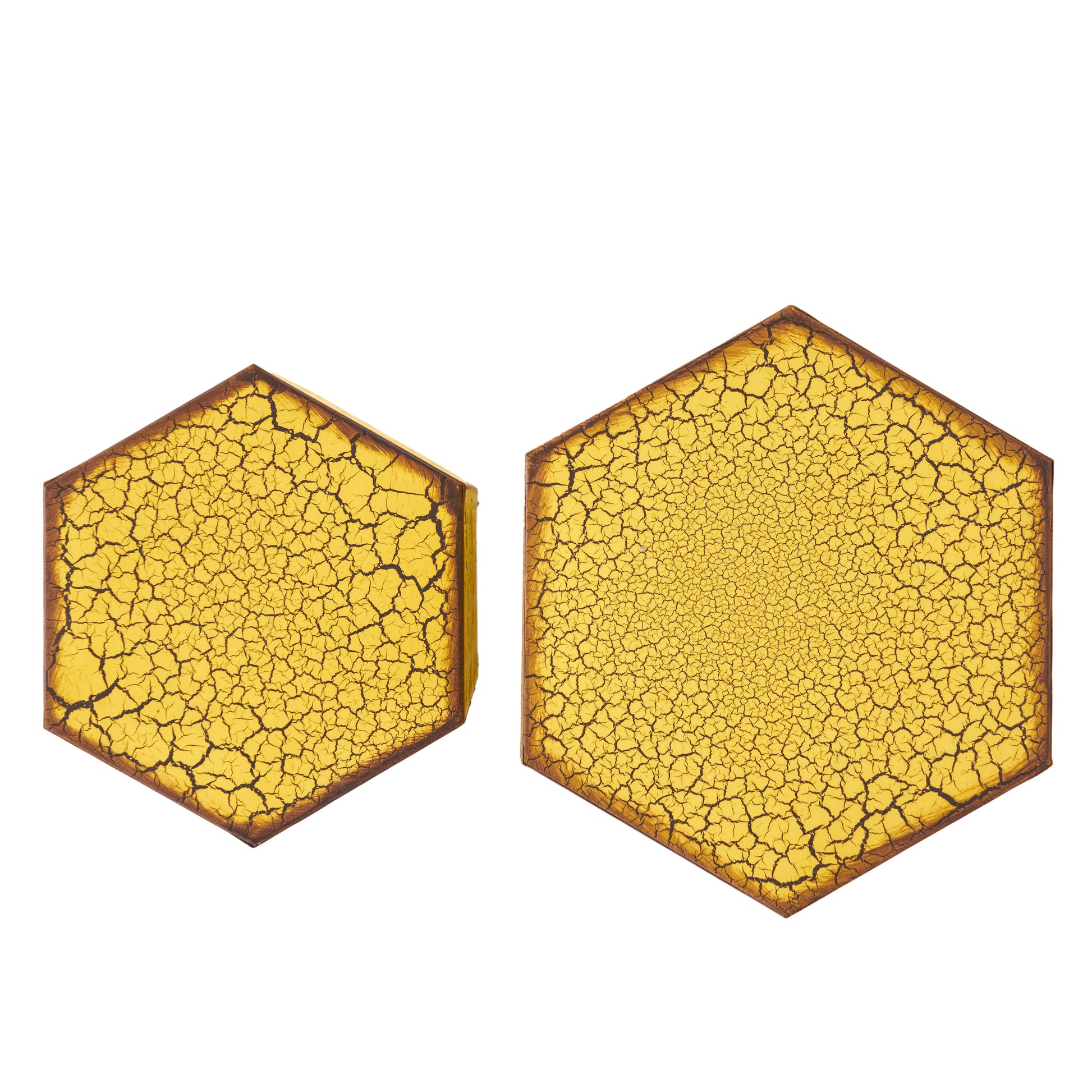 Hexagonal amber resin coaster with a cracked earth pattern and dark brown trim