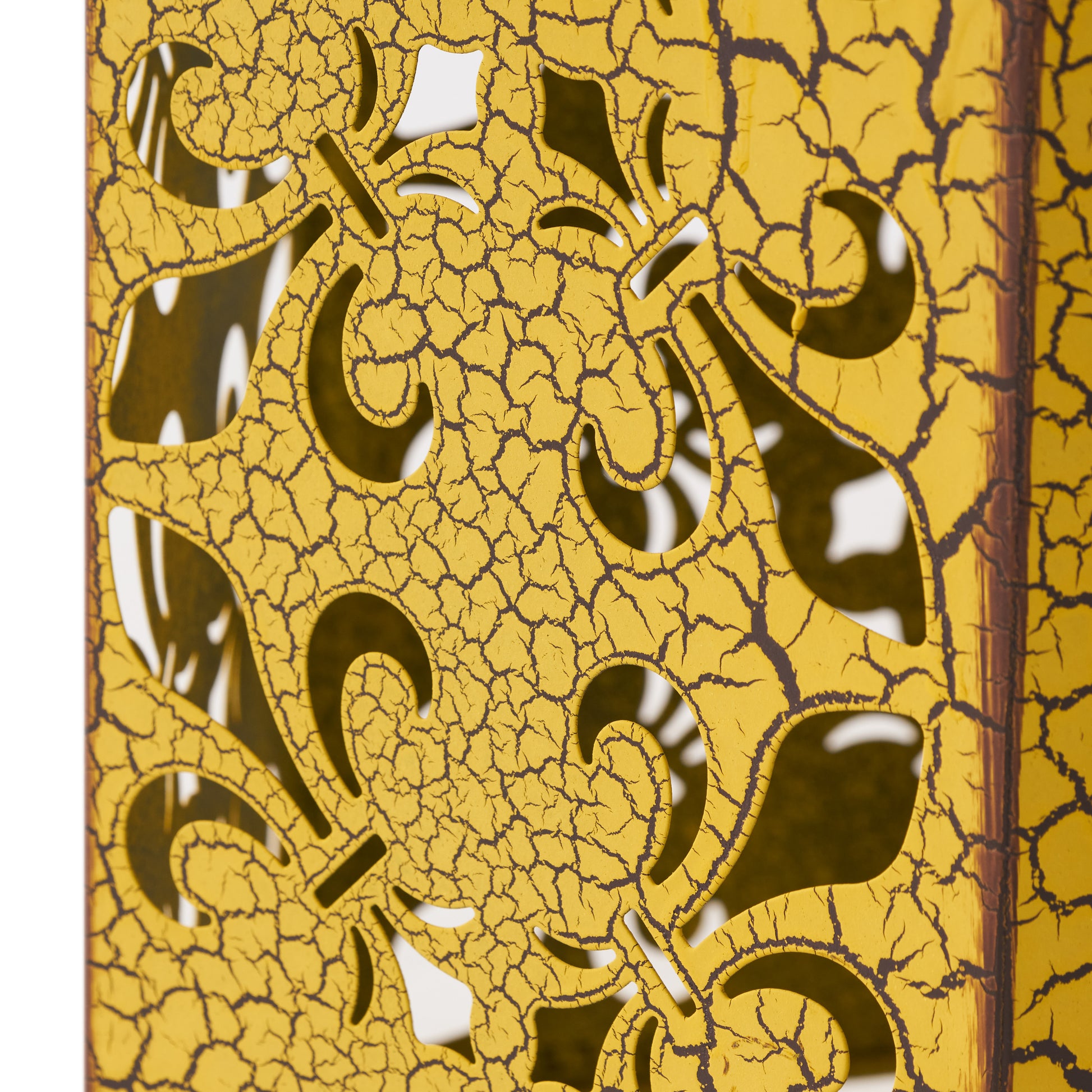 Ornate yellow metal lantern with crackle finish and floral cutouts